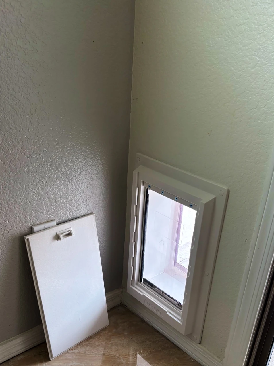 Completed Apollo pet door installation in a customer home, project 20