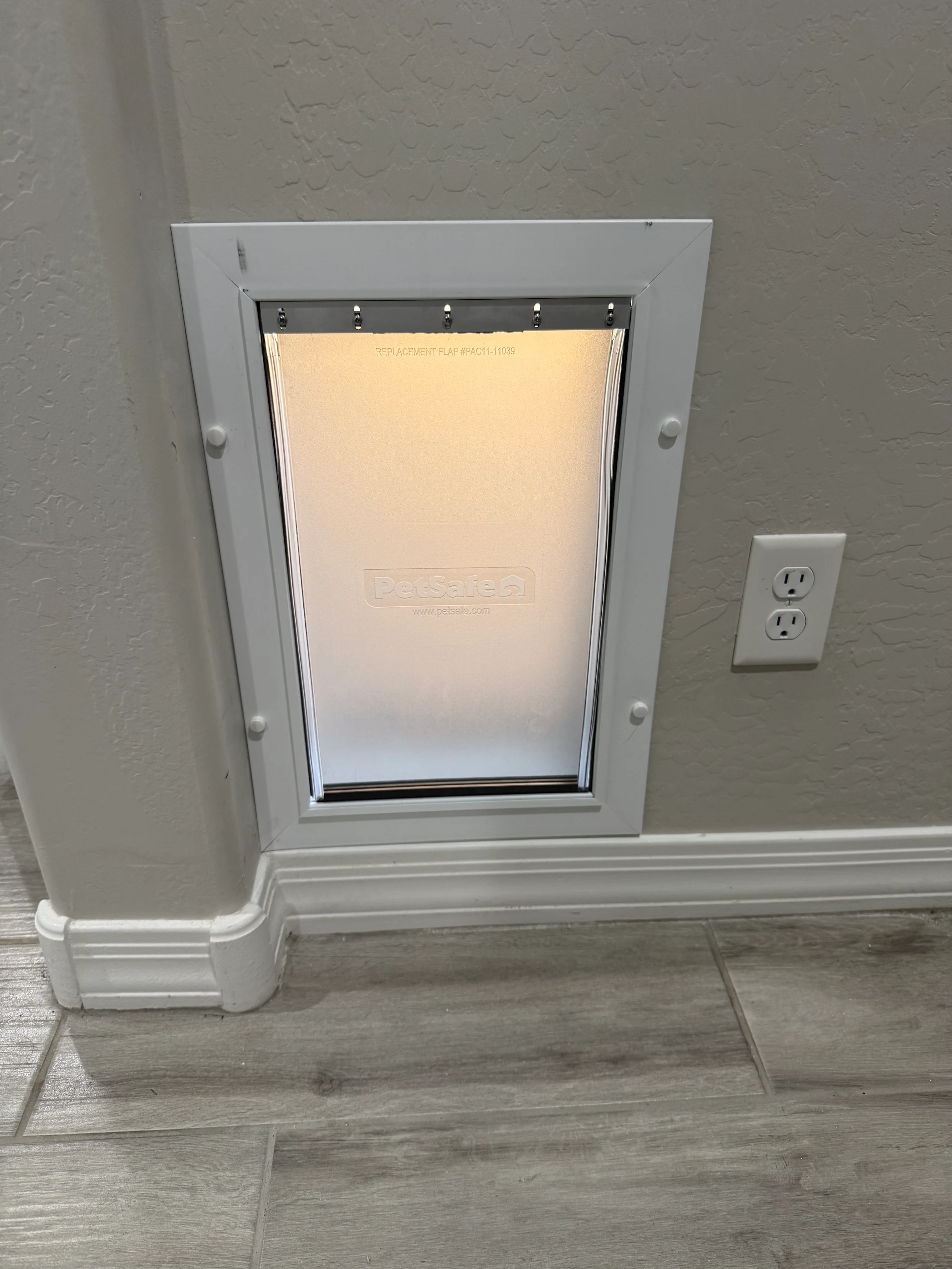 Completed Apollo pet door installation in a customer home, project 7